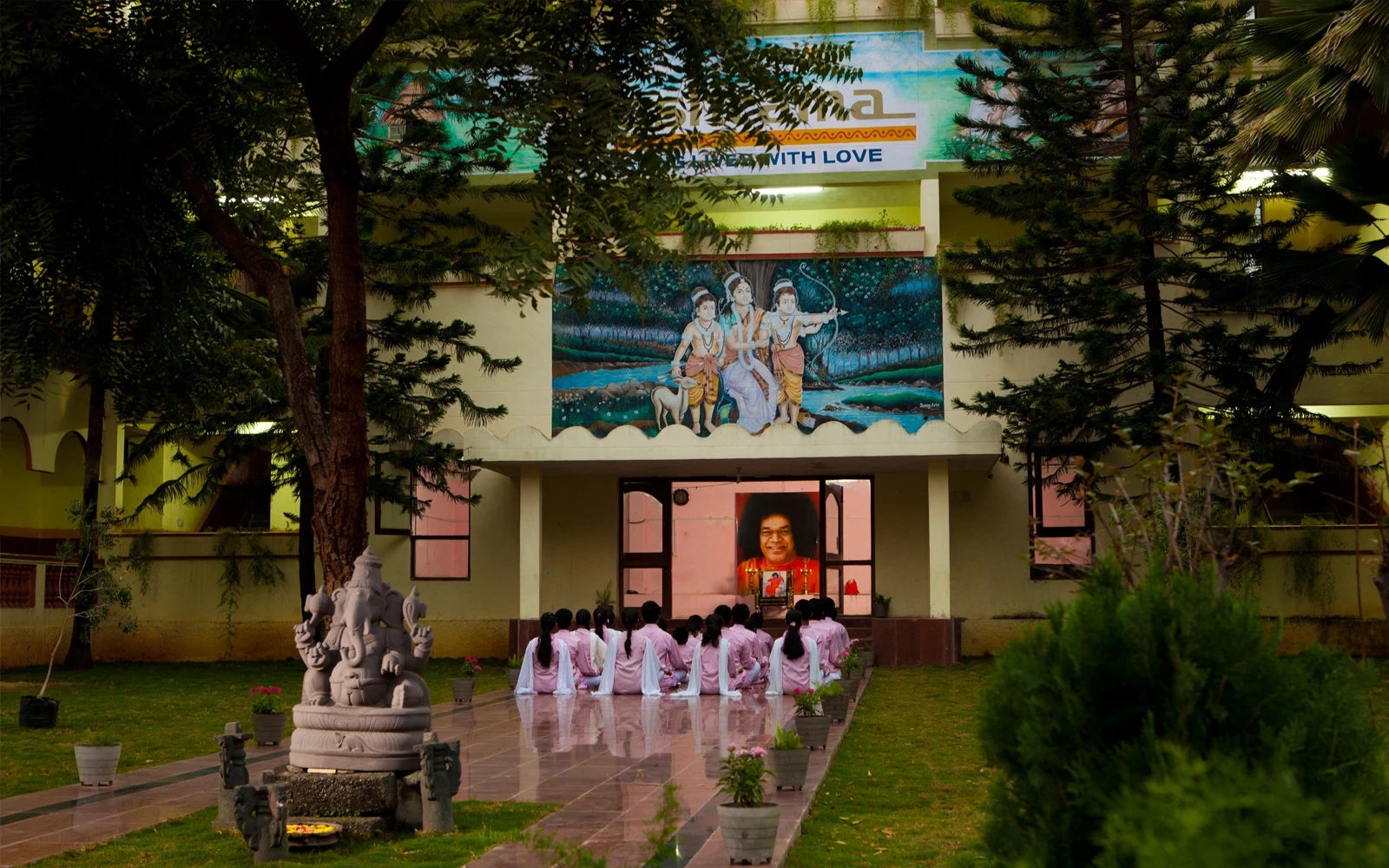 Students and staff celebrating school achievement award at Abhyasa School