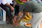 Students Perform Pada Pooja to Their Parents